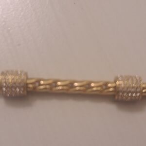 Gold Tone Twisted Bar Bracelet with Pavé End Caps